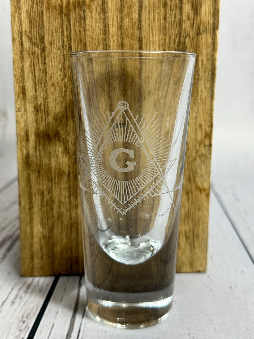 Masonic shot glass featuring laser-etched emblems of Freemasonry